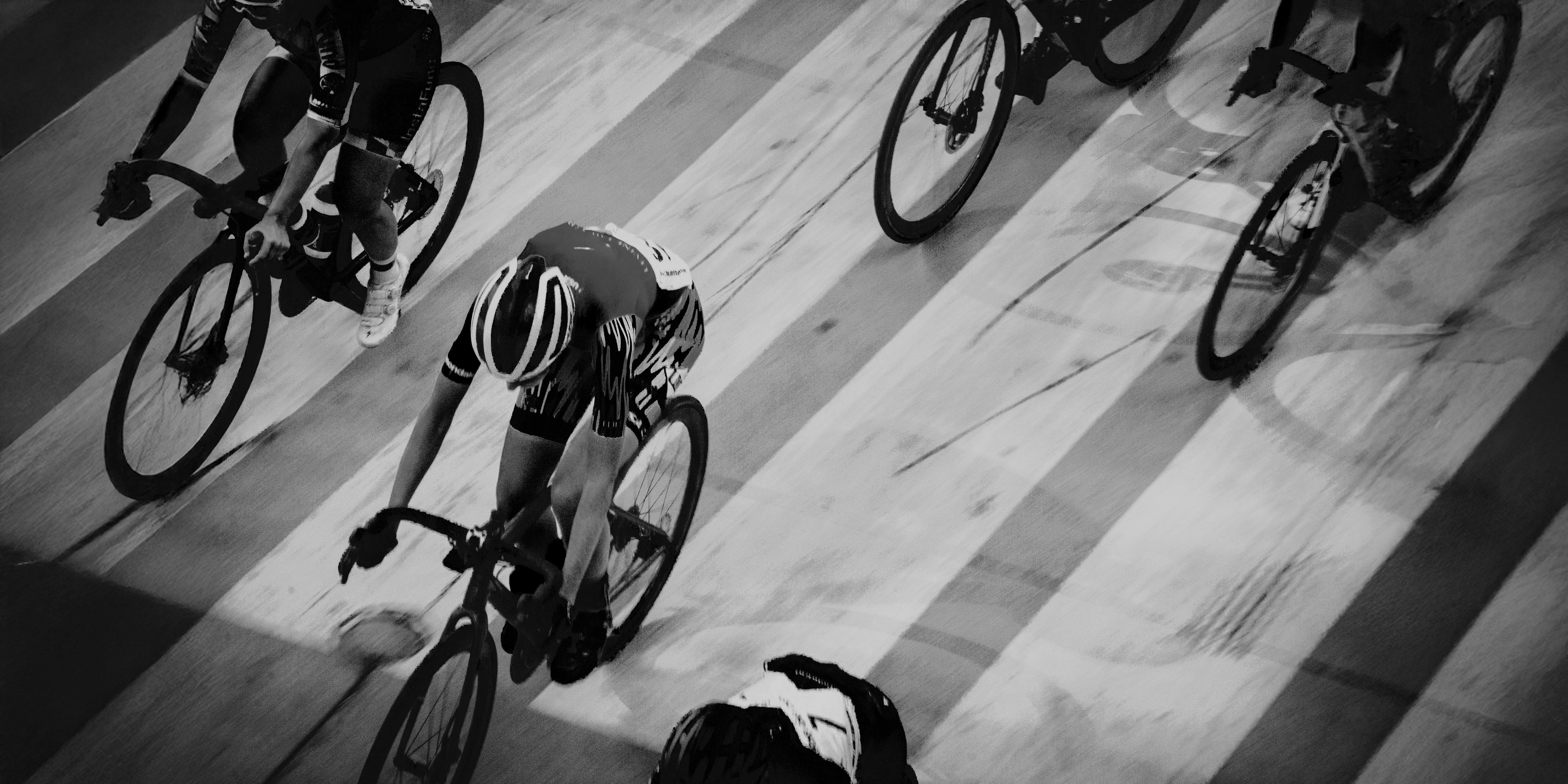 Cyclists on a velodrome track